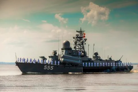 A small rocket ship passes along Kronstadt Stock Photos