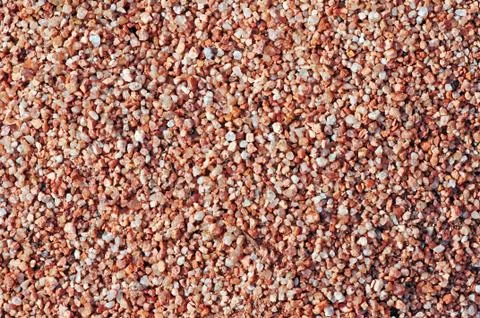 Small rocks background - rocky pattern. Stock Photos