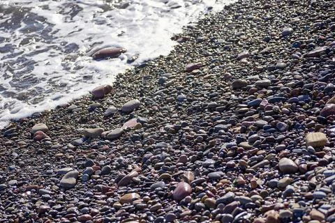 Small rocks beach shore Stock Photos