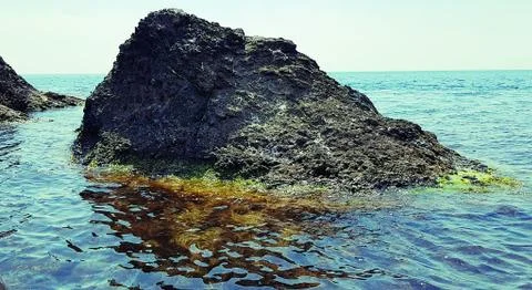 Small rocks in the sea Stock Photos