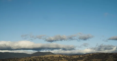 Small Rolling Clouds Over Mountain Timelapse 4K Stock Footage 113936181