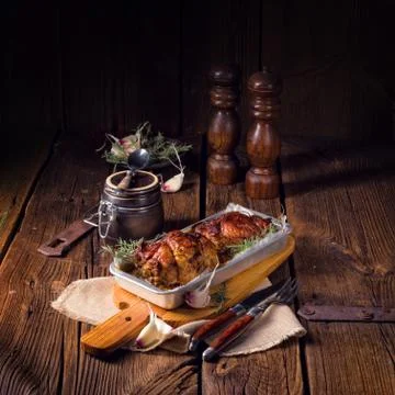 Small Rolling roasts fully with dried fruit and bacon Stock Photos