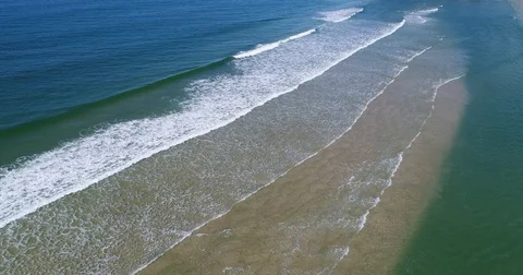 Small Rolling Waves at the beach by Drone 4K Video stock 74943568