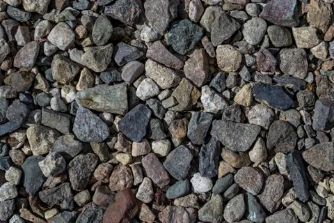 Small rough stones texture background close-up The rough texture of the stone Stock Photos