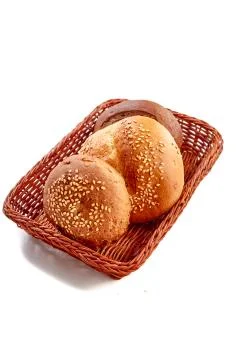 Small round buns lie in the bread basket Stock Photos