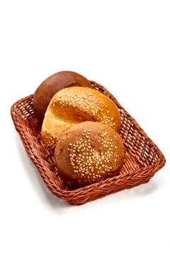 Small round buns lie in the bread basket Stock Photos
