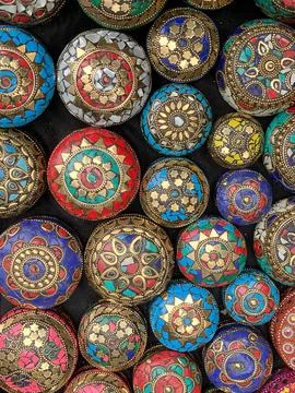 Small, round, intricately patterned metal boxes on sale, Fez, Morocco Stock Photos