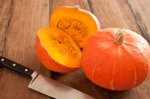 Small round oddly shaped pumpkin cut in middle Stock Photos