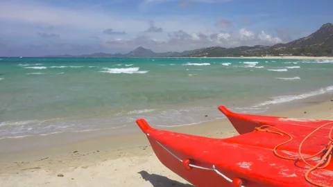 Small Rowing Lifeguard Boat on a Wild Beach in Sardinia Stock Footage 78492953