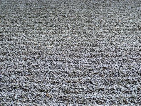 Small rubble. Background of gray rubble. Coarse gray sand. Stock Photos