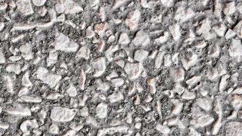 Small rubble stone on cement mortar, rotating, turning 스톡 동영상 243990537