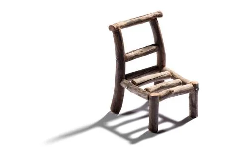Small rustic handmade model of a chair Stock Photos