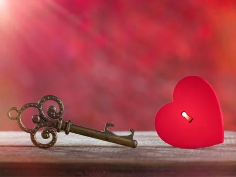 Small rustic red heart with old key Stock Photos