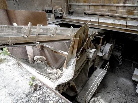 Small rusty old stone crusher in the open air Stock Photos