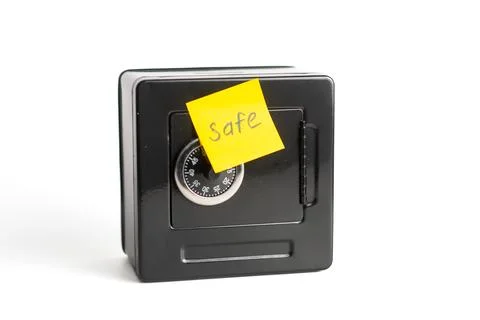 Small safe with combination lock and yellow sticky note Stock Photos