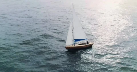Small sailboat on the high seas Stock Footage 296603711