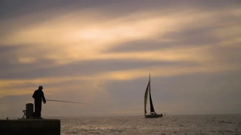 A small sailboat is sailing in the ocean Stock Footage 155030690