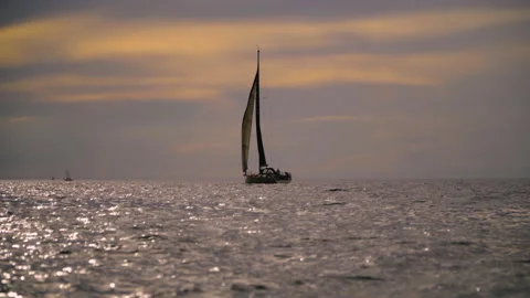 A small sailboat is sailing in the ocean Stock Footage 155030750