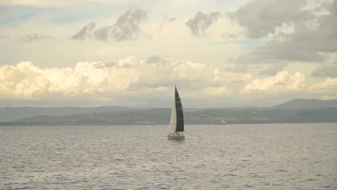 A small sailboat is sailing in the ocean Stock Footage 155033907