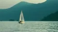 small sailboat at sunset HD Footage