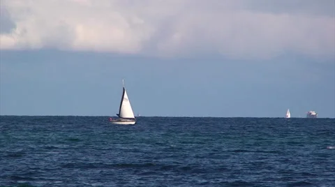 Small sailing boat advances to Saint Tropez port Stock Footage 51047713