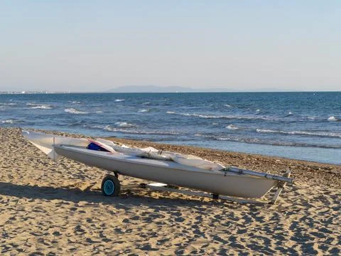 Small sailing boat on a cart on the beach Stock Photos