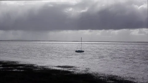 Small sailing boat strormy sea sky Stock Footage 82574896