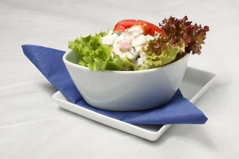 Small salad with dressing Stock Photos