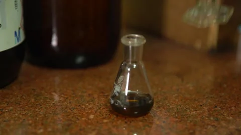 A small sample of bitumen is being prepared and testing in materials lab Stock Footage 329210701