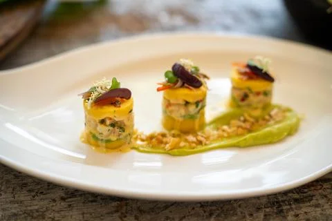 Small samples of peruvian potato cakes consisting of shrimp and various veg.. 스톡 사진