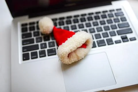 The small Santa hat on the top of computer's keyboard Stock Photos