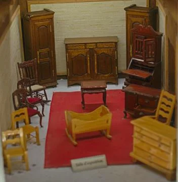 Small scale model representing room with old style wooden furniture Stock Photos