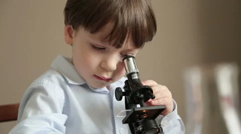 Small scientist with a microscope Stock Footage 59603725
