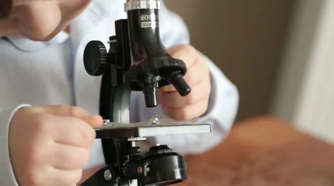 Small Scientist with a Microscope Stock Footage 66298588