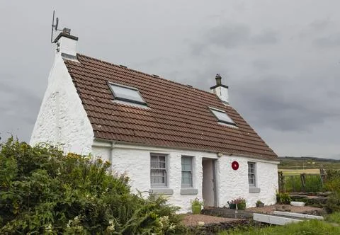 Small scottish croft with a bridge at the front door Stock Photos