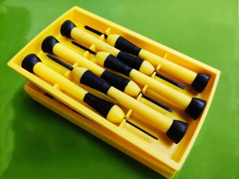 Small Screw Driver mini precision set on green background. 스톡 사진