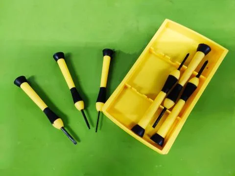 Small Screw Driver mini precision set on green background. 스톡 사진