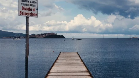Small sea dock at sunrise, clouds, cold light Stock Footage 93790812