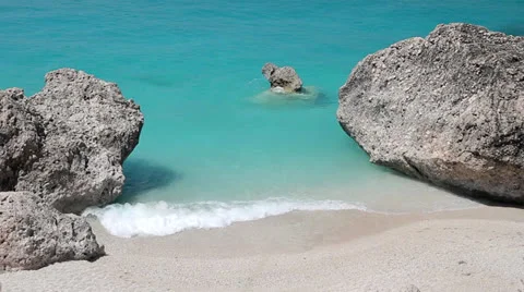 Small sea waves hit white rocks Stock Footage 25993762