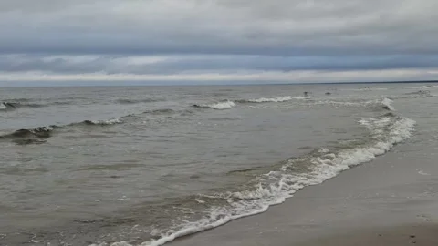 Small Sea Waves Rolling Toward Shore with Natural Sound Stock Footage 323463039