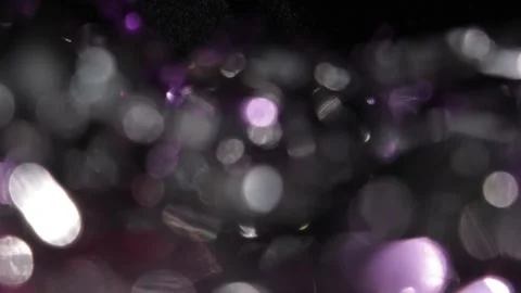 Small seamless purple and white bokehs glowing in the dark seamlessly Stockbeeldmateriaal 318072811