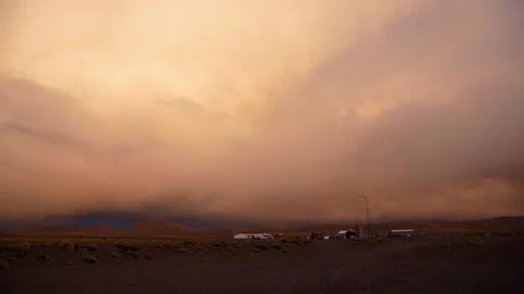 Small Settlement In The Desert At Sunset With Illuminated Clouds Stock Footage 168143805