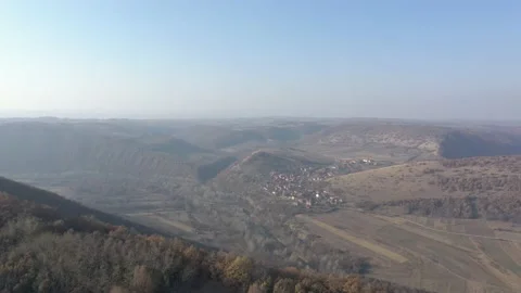 Small settlement under the hill of Eastern Serbia 4K drone footage Stock Footage 99776622