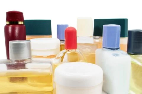 Small shampoo plastic bottles close up on white Stock Photos