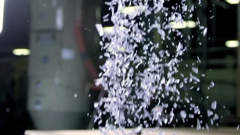 Small Shards Of Recycled Plastic Fall Into A Container Stockbeeldmateriaal 78518378