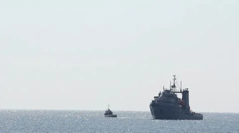 Small ship and big ship sailing on the sea near the harbor Video stock 12273612