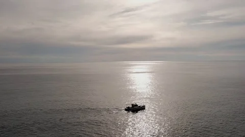 Small ship crossing on sea sunset Stock Footage 106628665