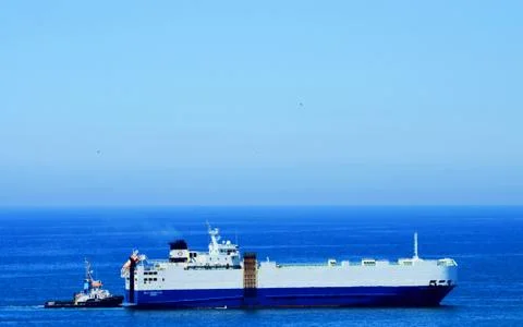 Small ship drives a large ship Stock Photos