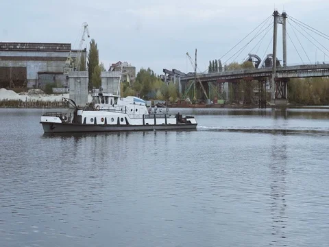Small ship floating in the port area Stock Footage 71866498