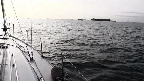 A small ship sailing in a bay Stock Footage 114238554